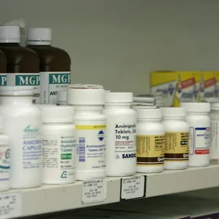 Pharmacy shelf with medicine bottles