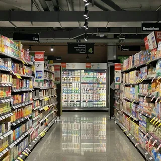 Supermarket aisle with stocked shelves